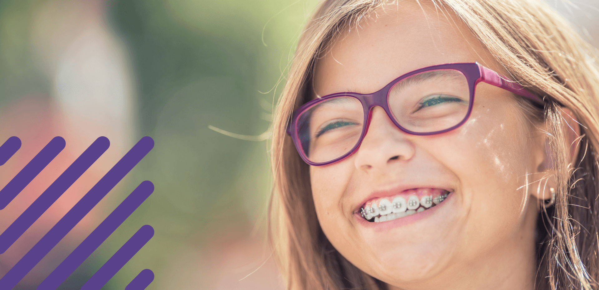 Girl smiling with braces put on